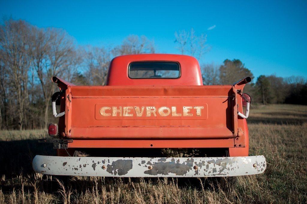 Red 1950 Chevy 3100 pickup truck