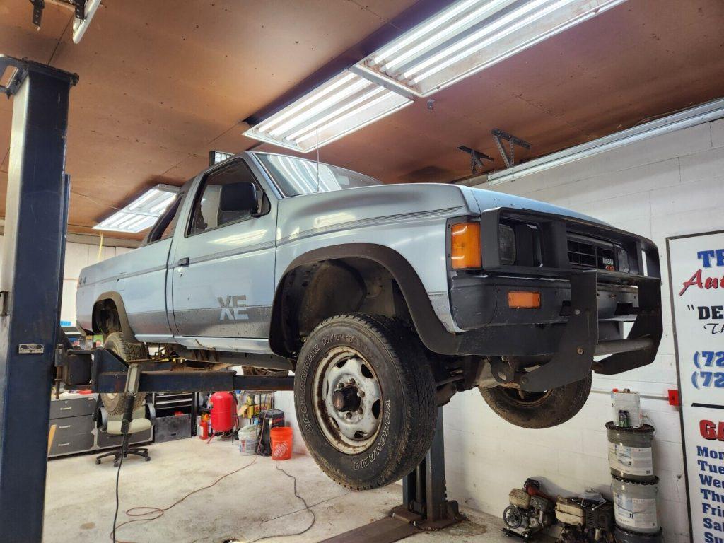 1987 Nissan D21 Hardbody long bed with contour styled light bar and grille guard