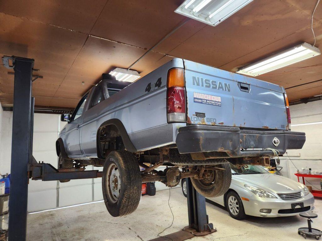 1987 Nissan D21 Hardbody long bed with contour styled light bar and grille guard